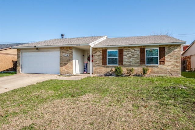 ranch-style home with a garage and a front lawn