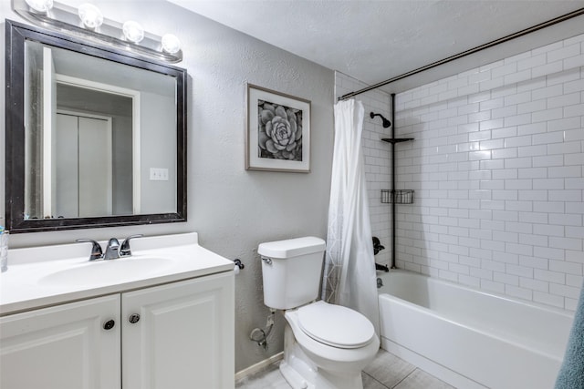 full bathroom with shower / bath combo, tile patterned floors, a textured ceiling, toilet, and vanity