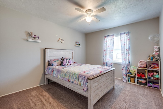 carpeted bedroom with ceiling fan and a textured ceiling