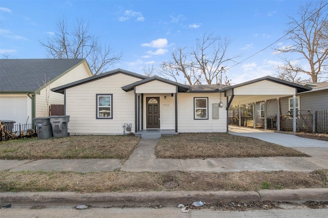 single story home featuring a carport