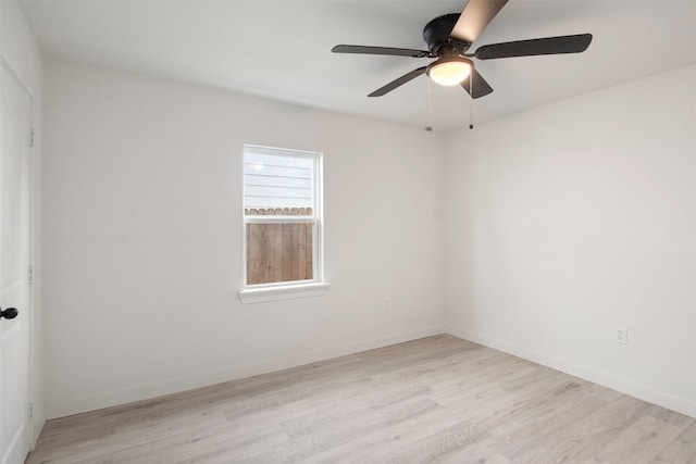 spare room featuring ceiling fan and light hardwood / wood-style floors