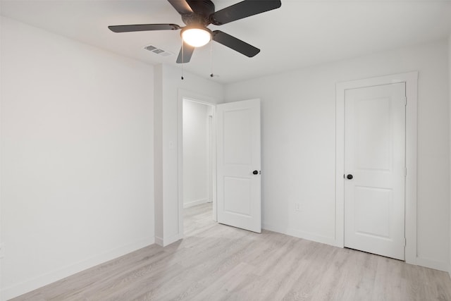 unfurnished bedroom with ceiling fan and light hardwood / wood-style flooring