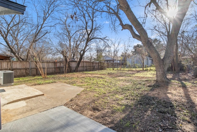 view of yard with a patio area and central air condition unit