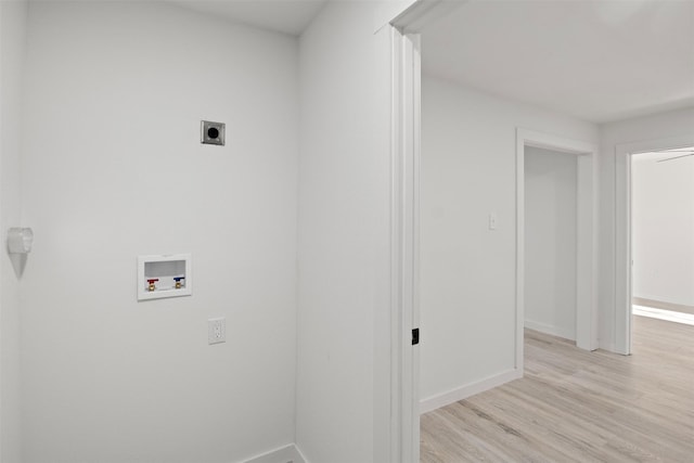 laundry area with hookup for a washing machine, light hardwood / wood-style flooring, and hookup for an electric dryer