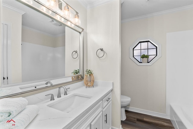 bathroom featuring wood-type flooring, vanity, toilet, and crown molding