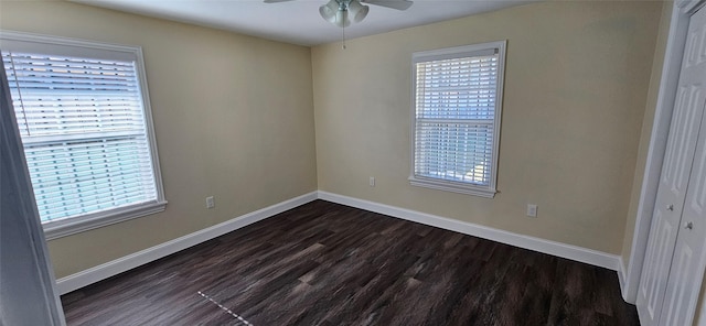 unfurnished room featuring dark hardwood / wood-style floors and ceiling fan