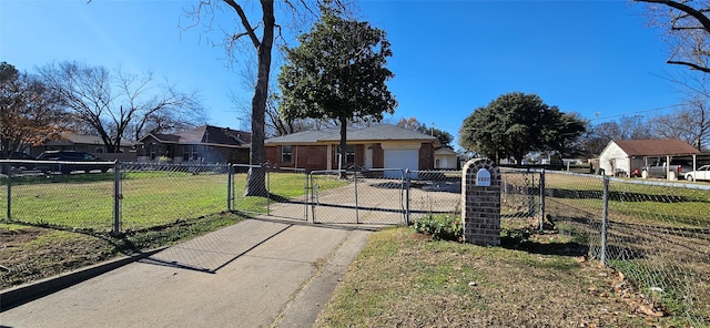 view of front of house featuring a front lawn and a garage