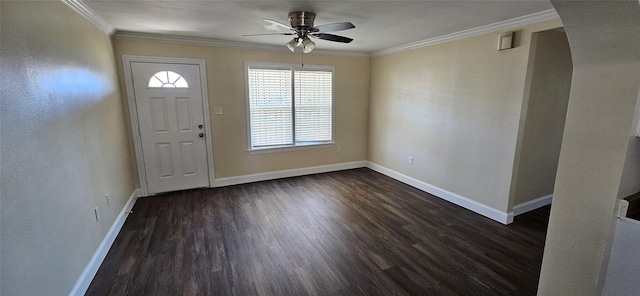 entryway featuring ceiling fan, ornamental molding, and dark wood-type flooring