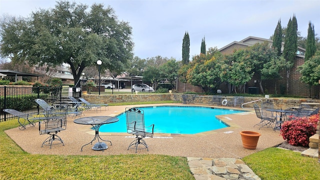 view of pool featuring a patio