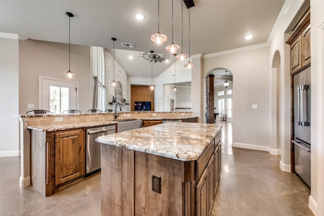 kitchen with a spacious island, ceiling fan, dishwasher, and hanging light fixtures