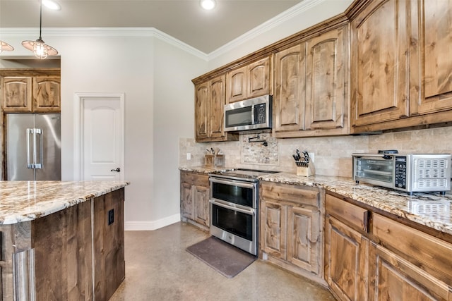 kitchen featuring light stone countertops, hanging light fixtures, stainless steel appliances, concrete floors, and ornamental molding