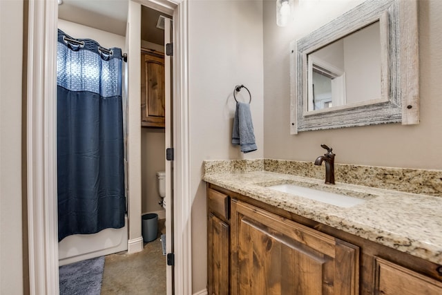 bathroom featuring vanity and toilet