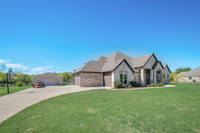 french provincial home featuring a garage and a front lawn