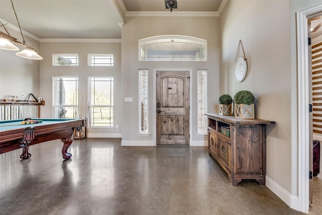 foyer featuring ornamental molding and pool table