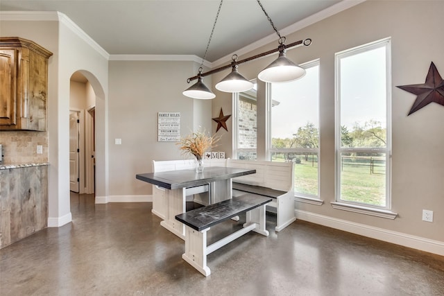 dining room featuring ornamental molding