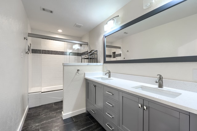 bathroom with enclosed tub / shower combo and vanity