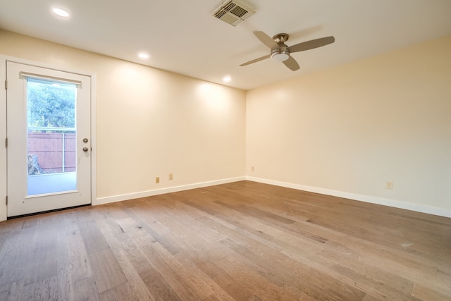 unfurnished room featuring hardwood / wood-style flooring and ceiling fan