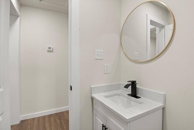 bathroom with vanity and wood-type flooring