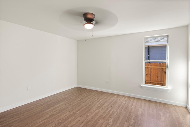 unfurnished room featuring ceiling fan and light wood-type flooring