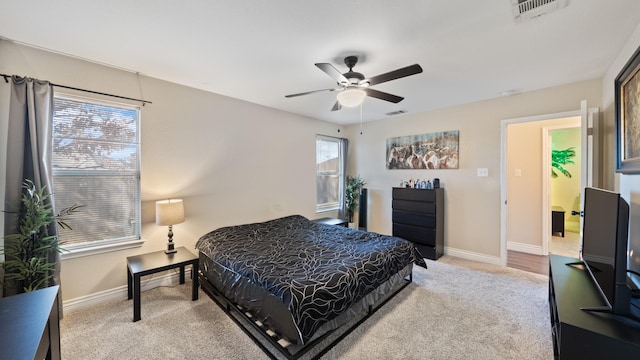 carpeted bedroom with ceiling fan