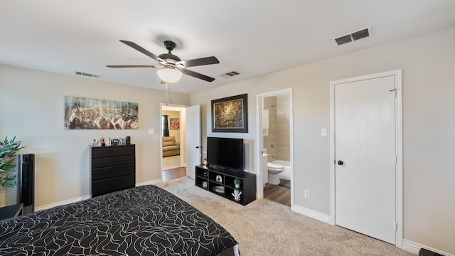 bedroom featuring carpet floors, connected bathroom, and ceiling fan