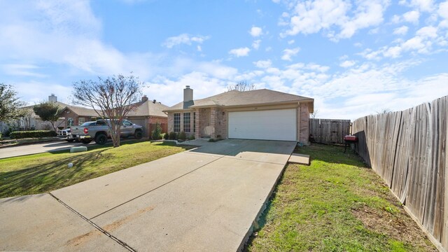 ranch-style home with a garage and a front lawn