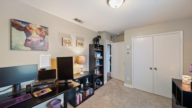 office area featuring light colored carpet