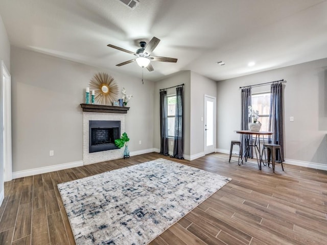 living room with hardwood / wood-style flooring and ceiling fan