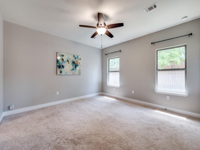 carpeted empty room with ceiling fan