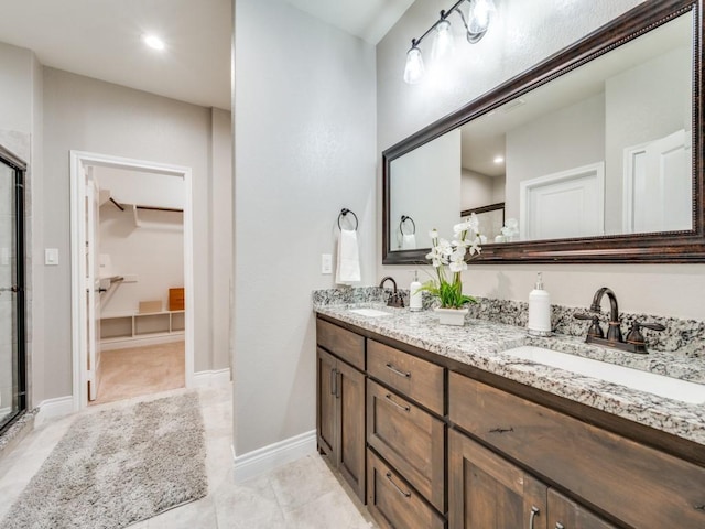 bathroom with vanity and walk in shower