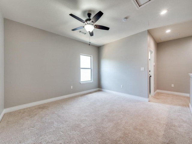 empty room with light carpet and ceiling fan