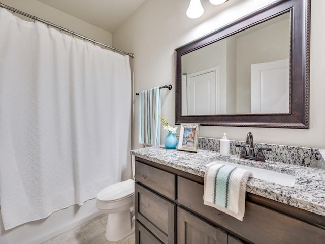 full bathroom with vanity, shower / tub combo, tile patterned flooring, and toilet