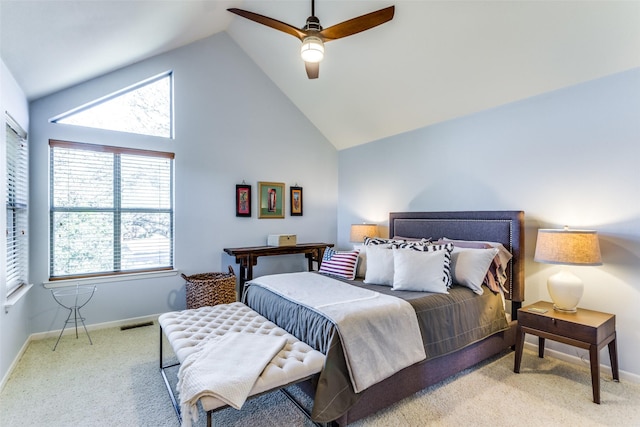 carpeted bedroom with ceiling fan and lofted ceiling