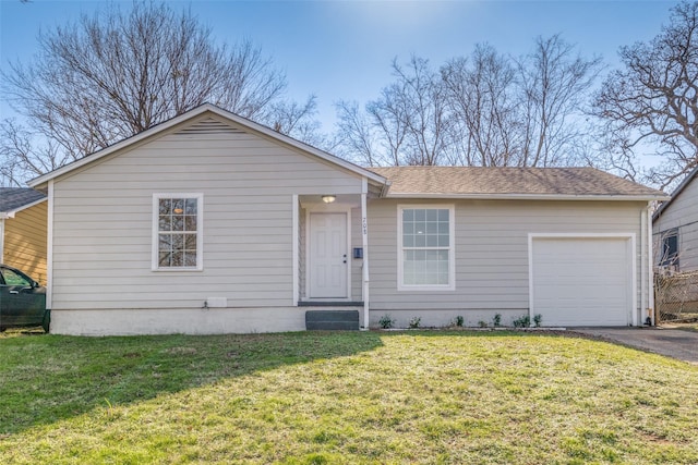 single story home with a garage and a front yard