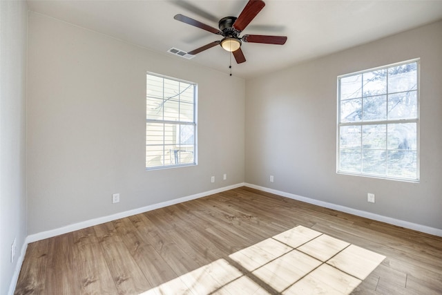 unfurnished room featuring light hardwood / wood-style floors and ceiling fan