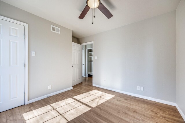 unfurnished bedroom featuring ceiling fan and light hardwood / wood-style flooring