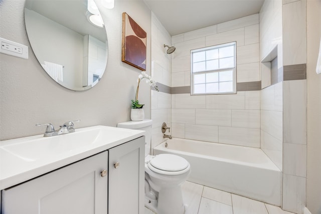 full bathroom with tile patterned flooring, vanity, toilet, and tiled shower / bath combo