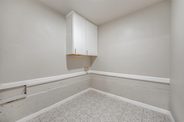 washroom with light tile patterned floors