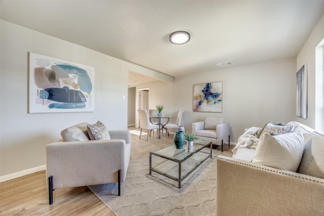 living room with light hardwood / wood-style floors