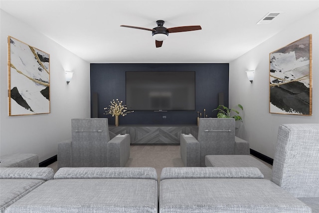 living area featuring baseboards, visible vents, and a ceiling fan