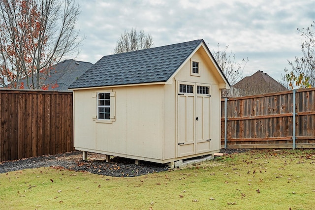 view of shed featuring a fenced backyard