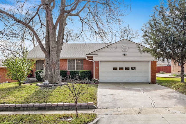 ranch-style house with a garage and a front yard