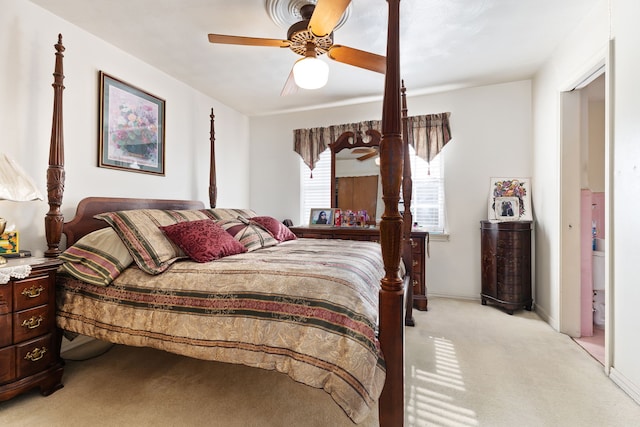 bedroom featuring light carpet and ceiling fan