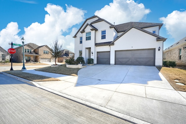 view of front of home with a residential view, driveway, and stucco siding