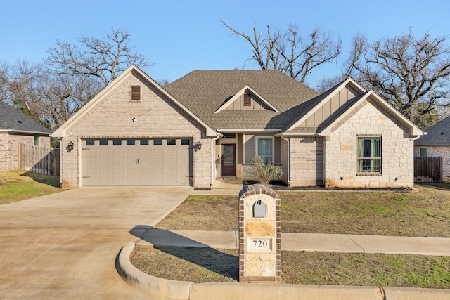 view of front of house with a garage and a front lawn