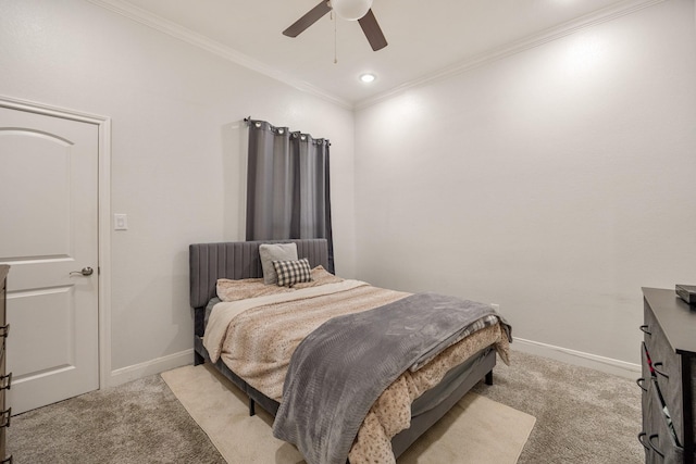 carpeted bedroom with ceiling fan and crown molding