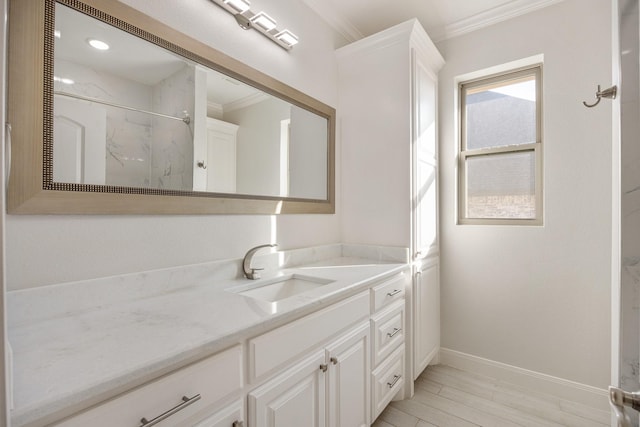 bathroom with a shower, wood-type flooring, vanity, and crown molding