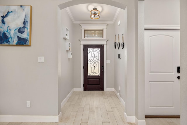 entrance foyer with light wood-type flooring and ornamental molding