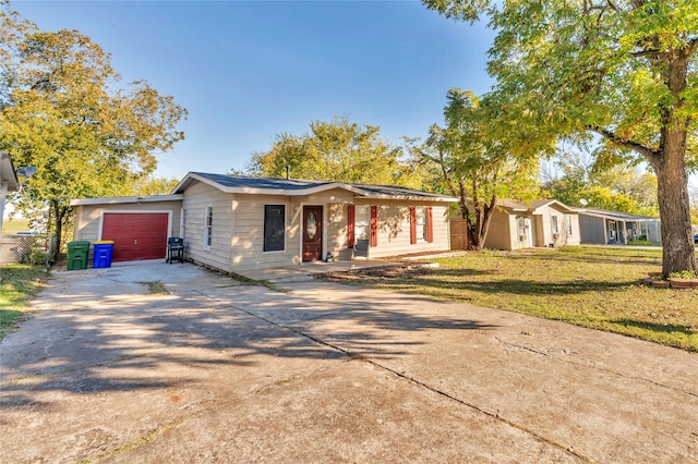 ranch-style home with a garage and a front yard