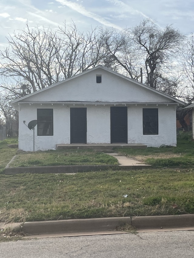 exterior space with a front lawn